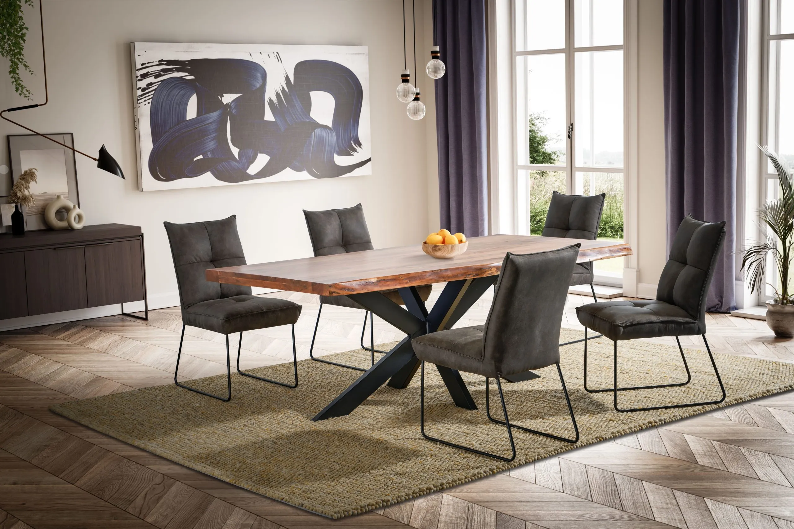 Solid oak top on a black metal X base, with grey upholstered chairs on black metal legs.